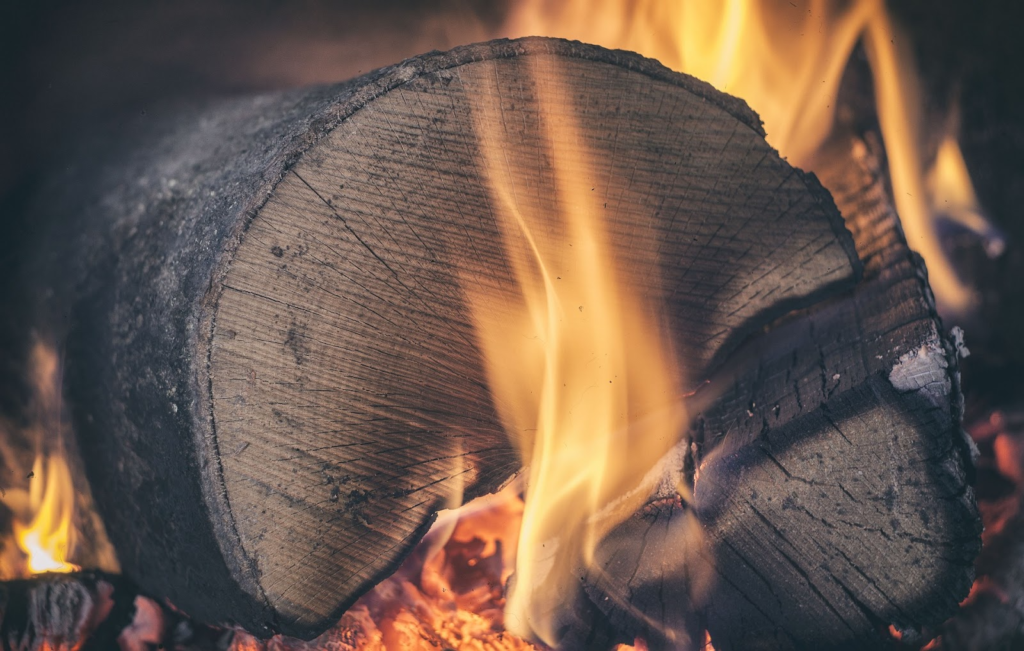 Burning wood as a traditional biomass fuel source