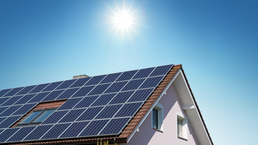 House with solar panels installed on roof on a sunny day